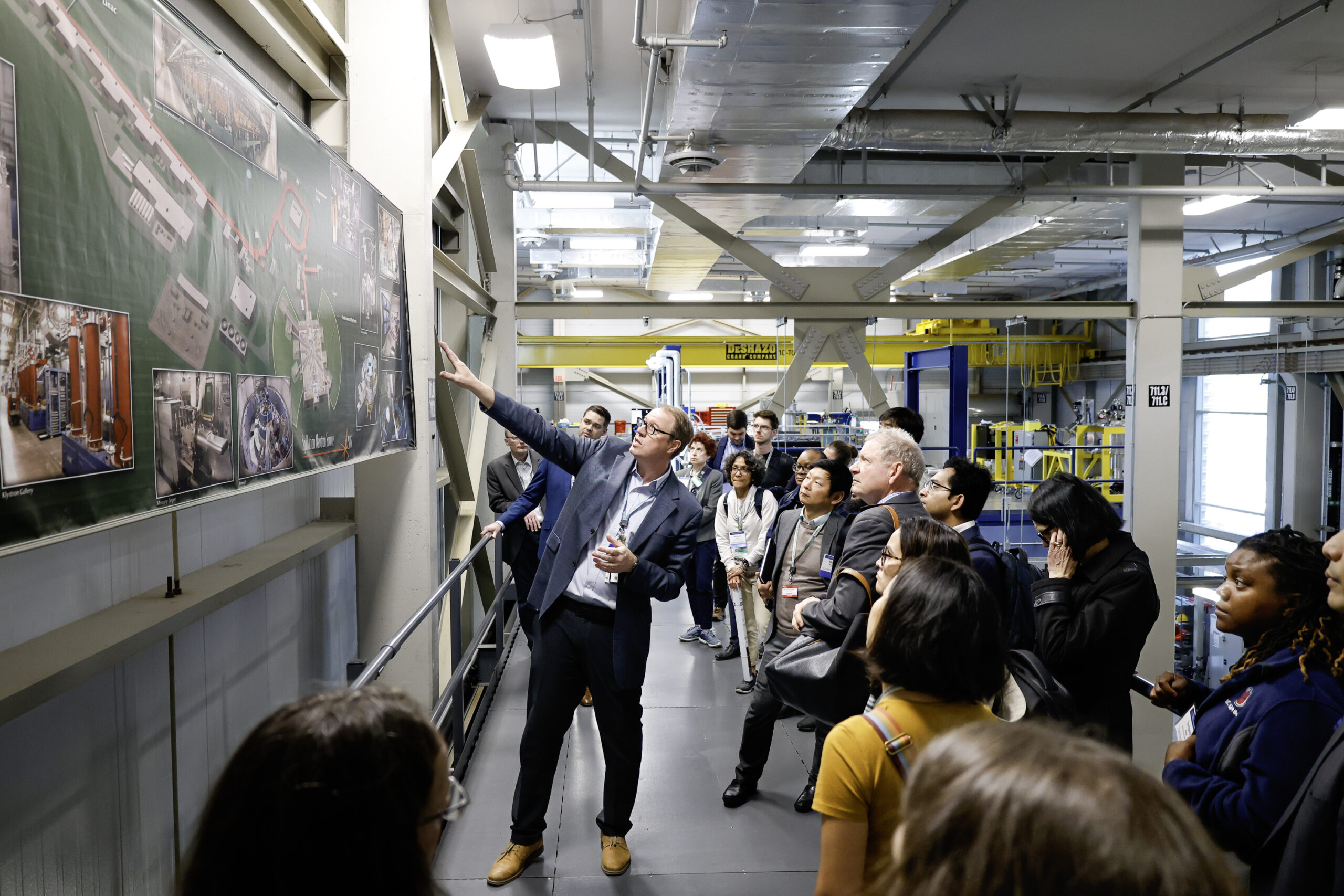 Jens Dilling, associate laboratory director for the Neutron Sciences Directorate, leads a tour of the Spallation Neutron Source as part of the German-American Frontiers of Engineering Symposium.