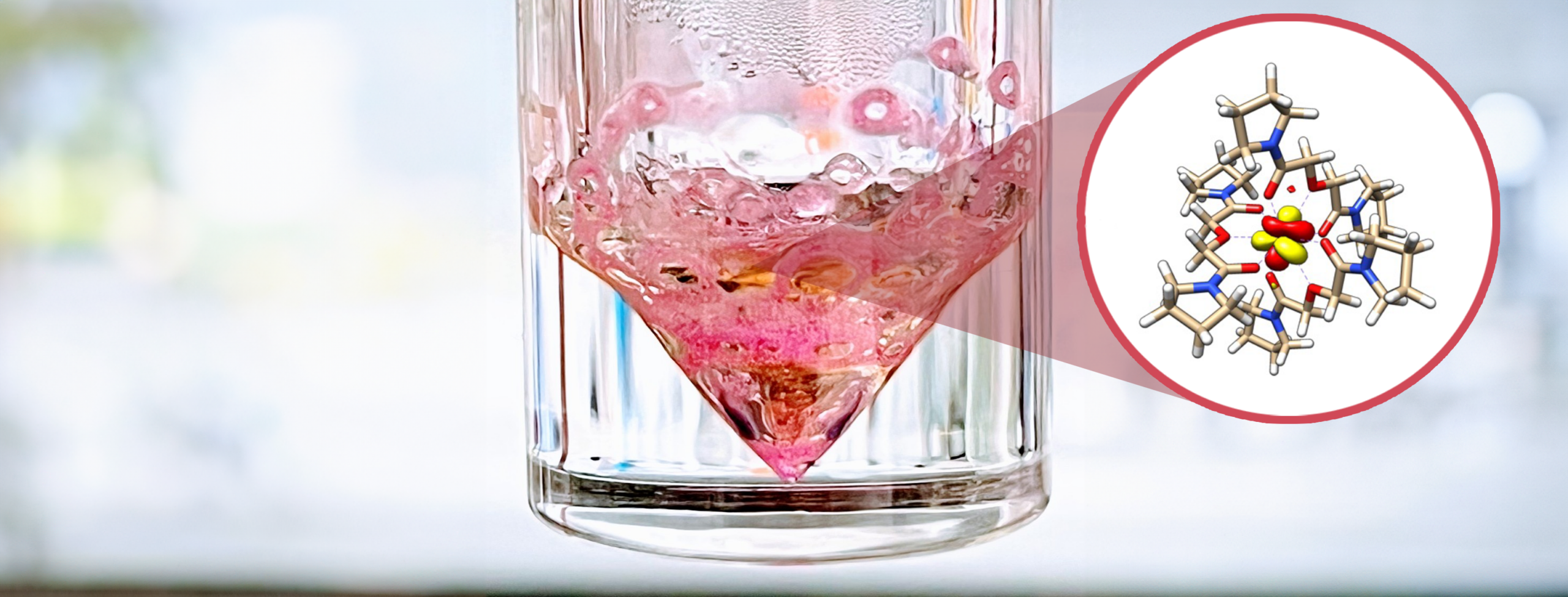 Pink diamond shape in a glass jar. There is a cut out showing the chemical makeup of what's inside.