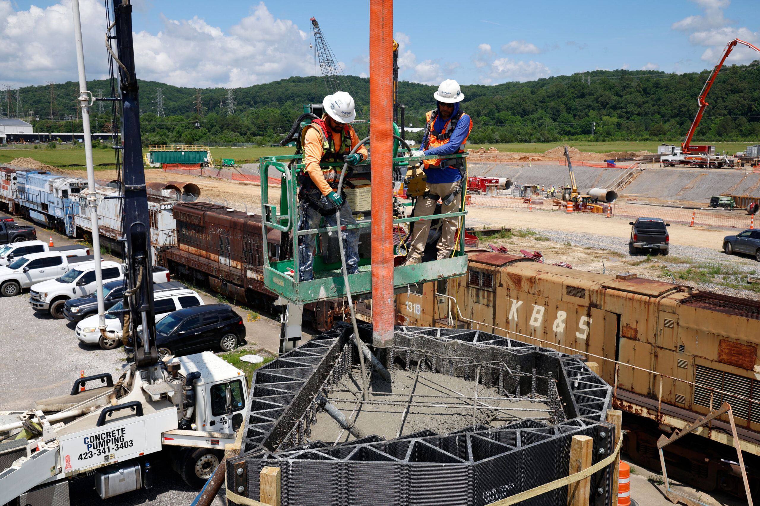 Barnard Construction workers pour concrete into the carbon-fiber-reinforced ABS form to produce one of the cast-in-place Janus columns.