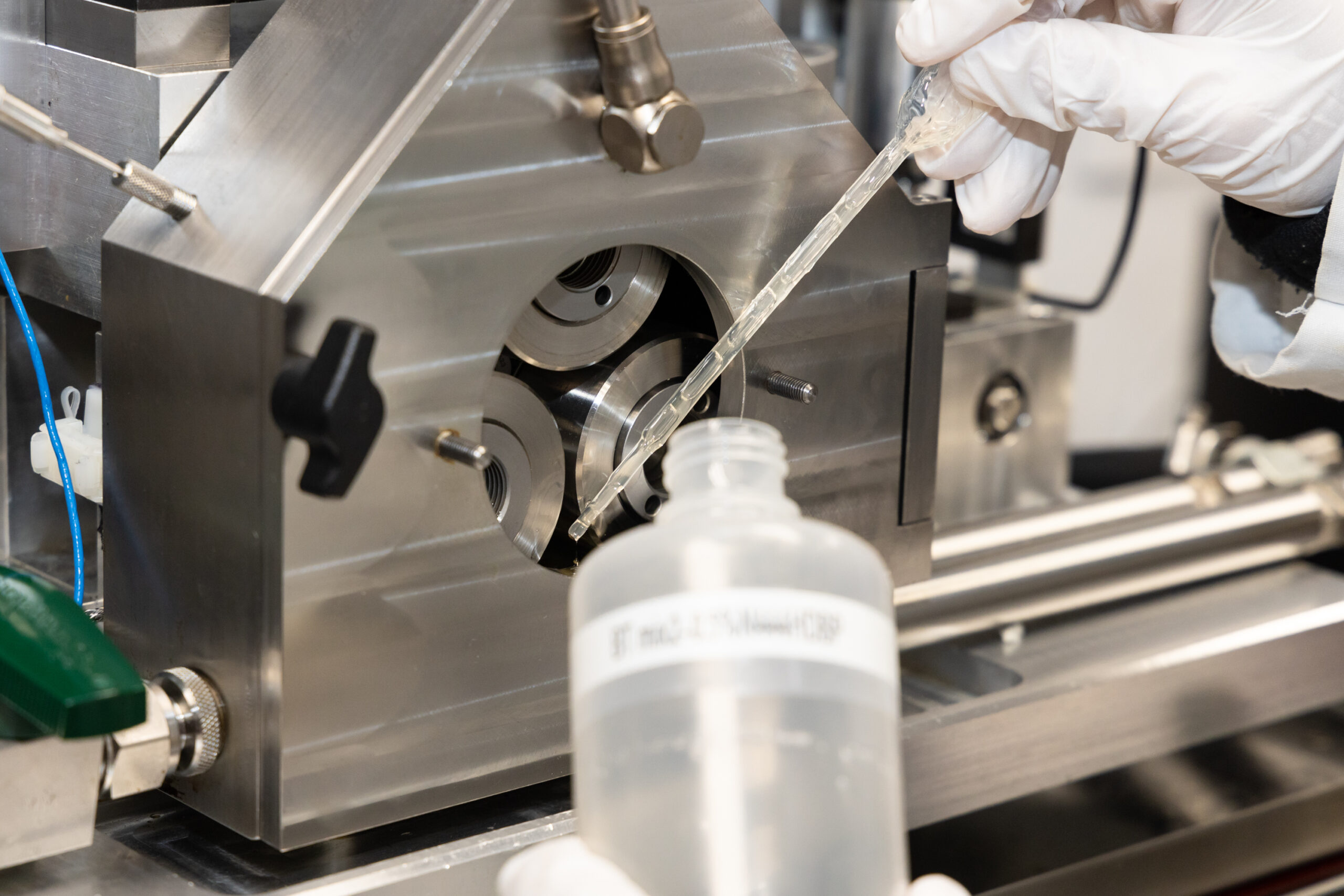 Testing with ORNL tribology equipment found that new ionic liquid-based lubricant additives developed for water turbines significantly reduced friction and equipment wear. Credit: Genevieve Martin, ORNL/U.S. Dept. of Energy