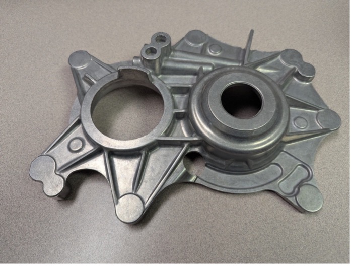 This automotive part was manufactured from RidgeAlloy, a new structural alloy developed by researchers at ORNL. It was cast using metals recycled entirely from post-consumer aluminum auto body sheets. 