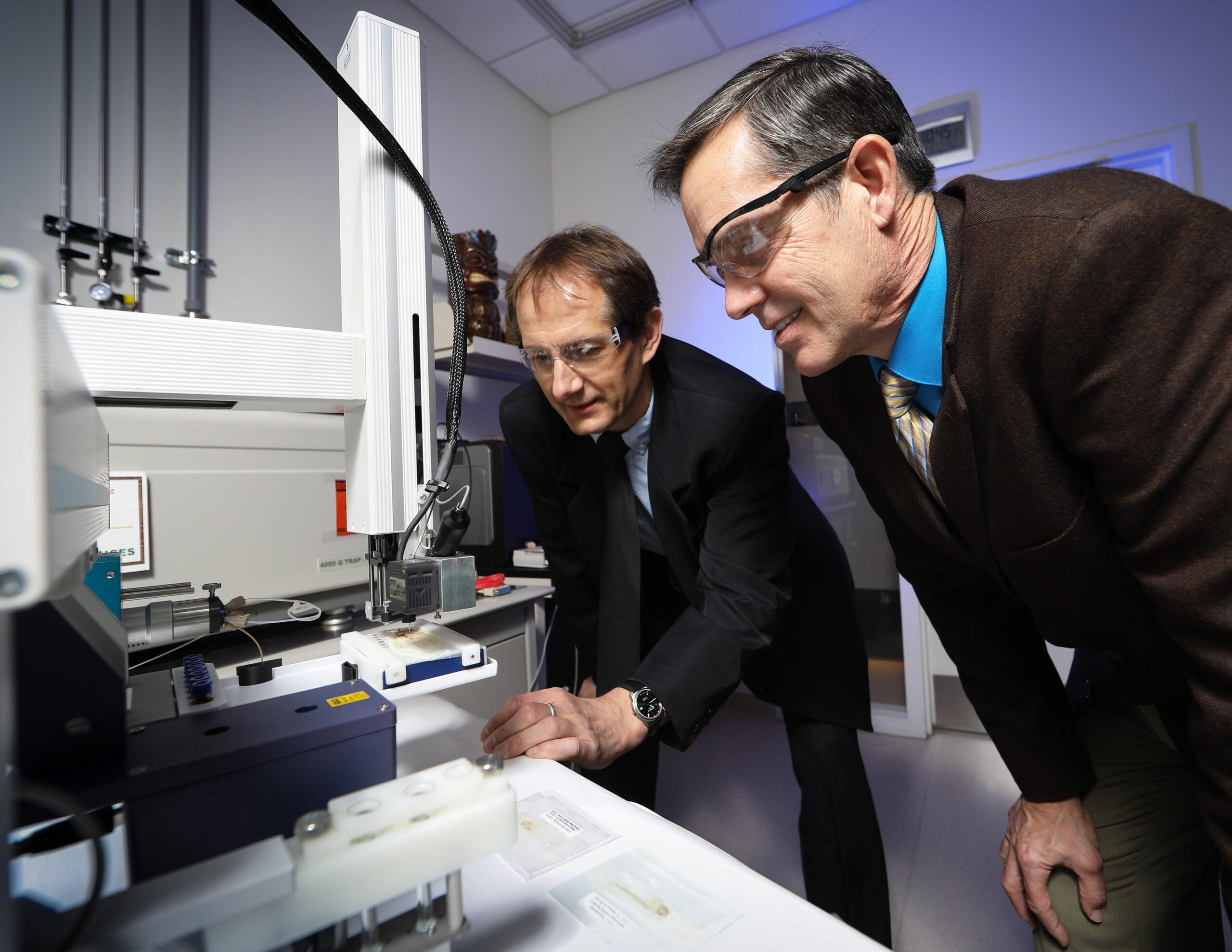Vilmos Kertesz, left, and Gary Van Berkel examine the dropletProbe system, a completely new means of surface sampling for mass spectrometry, a major scientific technique for measuring the masses of chemicals in a sample.