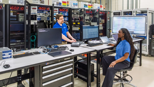 Aaron Werth discusses cybersecurity platform scenarios with GridForge founder and CEO Worlasie Djameh at the Hardin Valley Campus Grid-C facility.