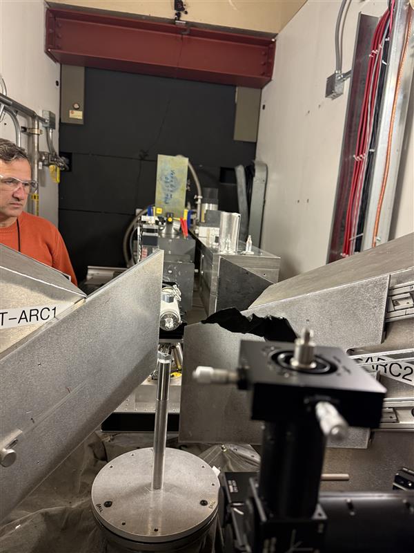 Beamline scientists at the Spallation Neutron Source align a neutron beam collimator to facilitate the first neutron scattering measurements on tristructural isotropic nuclear fuel containing high assay, low enriched uranium.