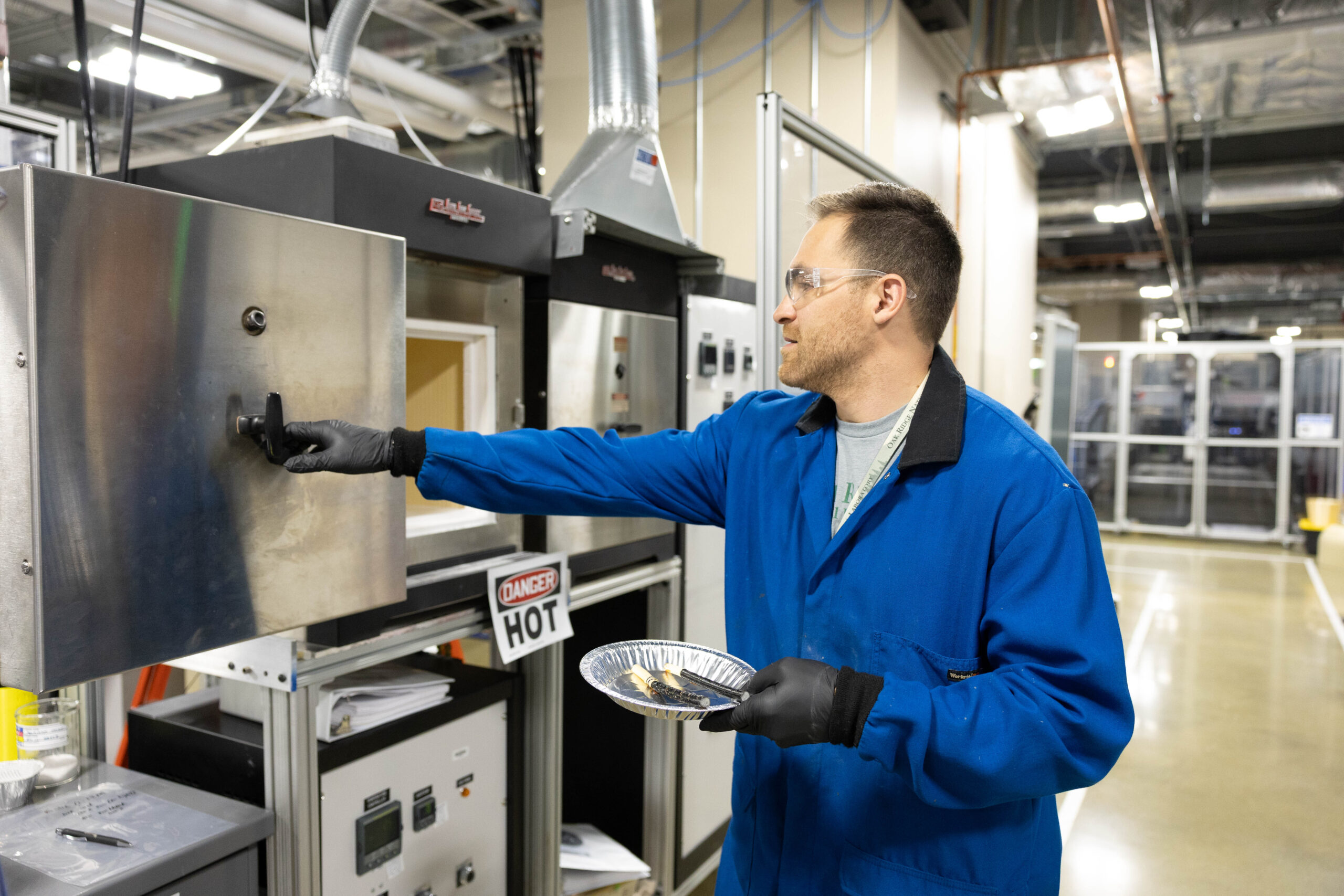 Corson Cramer, staff scientist in the Manufacturing Science Division at ORNL, is shown curing continuous silicon carbide fiber tubes at the Manufacturing Demonstration Facility. Credit: Amy Smotherman Burgess/ORNL, U.S. Dept. of Energy