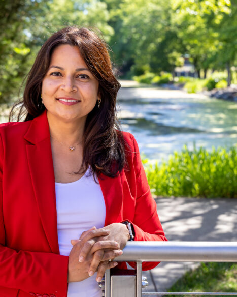 Udaya C. Kalluri stands outdoors near a pond at Oak Ridge National Laboratory during a portrait session.
