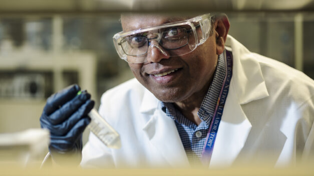 Parans Paranthaman perform direct lithium extraction from brine samples in a laboratory in Building 4100 at Oak Ridge National Laboratory.