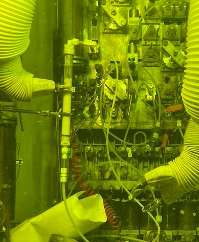 Radiochemical processing equipment inside a shielded hot cell.